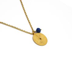 This handmade Lapis Lazuli Circular Pendant Necklace is crafted with a gold-plated stainless steel chain and a 22k gold-plated brass circular pendant, showcasing a beautiful lapis lazuli gemstone. It makes a luxurious, timeless addition to any outfit. Nickel and lead free Necklace Length: 23" Due to the handmade feature of the collection, all items are limited availability and are not mass produced. * Please note slight variations of color/ shape/ stones may occur due to its handmade feature Car Lapis Lazuli Gemstone, Color Shapes, Handmade Necklace, 22k Gold, Steel Chain, Necklace Length, Stainless Steel Chain, Lapis Lazuli, Handmade Necklaces