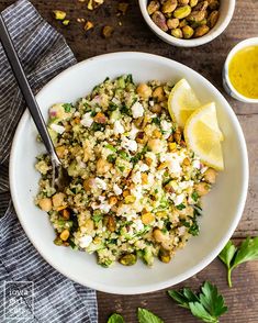 a white bowl filled with rice, chickpeas and garnished with cilantro