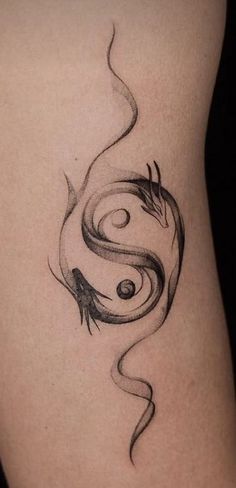 a woman's thigh with a tattoo design on it