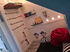 there is a bedroom with dr seuss wall decals on the walls