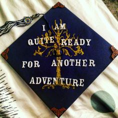 a blue graduation cap with the words i am quite ready for another adventure on it