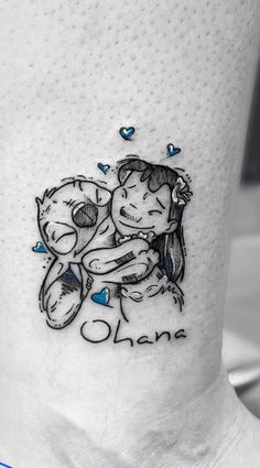 a couple hugging each other on the side of a leg with blue hearts around them