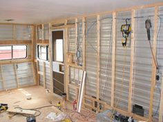 the inside of a house being remodeled with wood framing and electrical wires on the wall