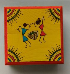 a small wooden box with an image of two people dancing on the front and side