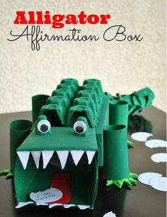 an alligator paper craft with the words alligator affirmation box in front of it