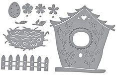 a birdhouse cutout with flowers and fence