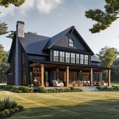 a large black house with lots of windows on the front and back of it's roof