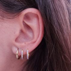 Our Simple Huggie Hoops are the perfect addition to your jewelry collection. The staple that you'll never want to take off, and never have to. Use these as a base for your curated ear stack or wear alone for a modern, minimalist allure. DETAILS & SIZE Sold as a pair Composition: 14k gold, rose gold, or white gold plated over sterling silver Measurements: Your choice of 5mm, 6mm, 7mm, 8mm, or 9mm Hinged hoops with a secure snap post closure Read about how to care for your jewelry here. Shop the E Ear Bar, Curated Ear, Ear Stack, Women's Jewelry And Accessories, Silver Material, Gold Rose, Rose Gold Plates, Women's Jewelry, Modern Minimalist