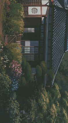 an aerial view of a building with trees and bushes