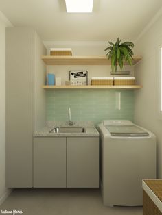 a washer and dryer in a room with shelves on the wall above them