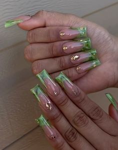 Green Acrylic Nails With Charms, Peridot French Tip Nails, Green Nails With Gems, Jade Nails Designs, Bad And Boujee Nails Green, Taurus Birthday Nails, Green Long Acrylic Nails With Diamonds, Long Acrylic Nails Green And Gold, Nails Extra