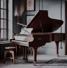 a grand piano sits in the corner of a room