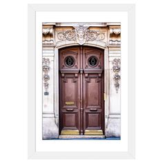 an old wooden door with ornate carvings on the front and side panels, framed in black