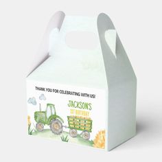 a white box with a tractor design on the front and side, that says thank you for celebrating with us