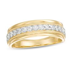 a yellow gold wedding ring with two rows of diamonds on the side and one row of white