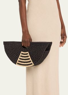 "Find EILAF Half Moon Raffia Top-handle Bag on Editorialist. The EILAF half moon top handle bag is crafted from raffia and leather. It features cut out top handles and can be worn as a clutch or a top handle bag. The bag has an open top and measures approximately 8.3\"H x 4\"W x 4.3\"D." Modern Black Top Handle Straw Bag, Black Straw Bag With Detachable Handle, Modern Straw Bag With Round Handle, Moon Top, Cut Out Top, The Bag, Open Top, Handle Bag, Half Moon