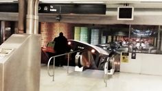 an escalator in a subway station with people on it