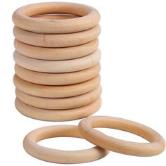 stack of wooden rings on white background with clippings for each one to place in