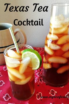 two glasses filled with drinks sitting on top of a table next to a pitcher and cup