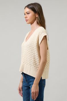 Add a fun vibe to all your favorite look, adding the Tacey V-Neck Sweater Vest Top. A knit textured features a v-neck that tops a sleeveless, box fit bodice. It's knitted in a mixed pattern to create the perfect texture. Pair it with denim and boots for a casual 'fit.- V-neck- Drop sleeve- Cable knit- Oversized armhole- Comes in 2 colorsSize + Fit - Model is 5'11" and wearing size XS- Measurements taken from size S - Chest: 20"- Length: 20 1/2" Fabric Self: 99% Acrylic 1% Nylon Style Number STT1 Denim And Boots, Drop Sleeve, Cropped Knit Sweater, Casual Fit, Pattern Mixing, Vest Top, Fitted Bodice, V Neck Sweater, Casual Fits