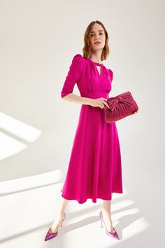 A beautiful 1940s-inspired midi dress cut from a high quality Italian stretch wool faille with stretch silk lining throughout the bodice and skirt. The bodice features an exquisitely cut neckline, with perfectly positioned gathering detail and front keyhole. A shaped underbust panel gives structure to the waist and creates a flattering empire line seam to lift and enhance the bust. A soft bias cut skirt falls from the waist seam to mid calf length. The neat raglan sleeve, that finishes just belo Suzannah London, Bias Cut Skirt, Soft Tailoring, Royal Outfits, Vintage Couture, Dinner Dress, Tweed Dress, Fall Skirts, Luxury Dress