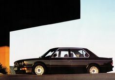 a black car parked in front of a building