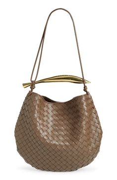 A sardine-inspired sculptural handle brings an artisanal touch to this hobo bag crafted of lambskin leather in the label's signature intrecciato weave. Magnetic closure Top carry handle; crossbody strap Unlined Leather Made in Italy Designer Handbags Bottega Veneta Hobo Bag, Bottega Veneta Intrecciato, Woman Bags Handbags, Leather Hobo Bag, Woven Bag, Leather Hobo, Handle Bag, Lambskin Leather, Crossbody Strap