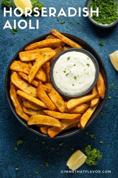 homemade horseradish aioli in a bowl with lemon wedges and parsley