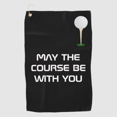 a black golf towel that says, may the course be with you