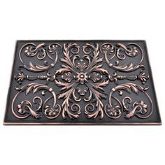 a door mat with an ornate design on the front and back side, in bronze