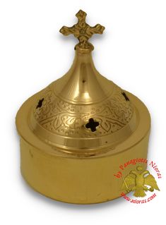 a gold plate with a cross on the top and an ornate design in the middle