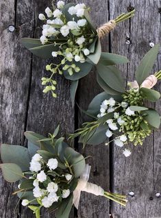 two bridal bouquets with greenery and baby's breath