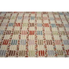 a multicolored rug with different patterns on it