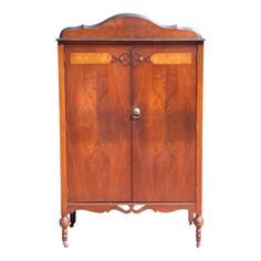 an old fashioned wooden cabinet with two doors