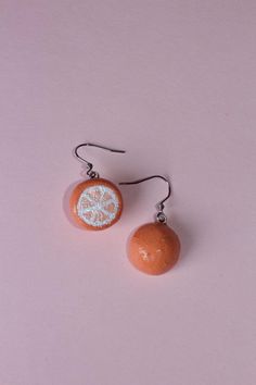 Celebrate your love for fruits with these adorable orange earrings! Crafted from high-quality polymer clay and stainless steel hardware, each piece is hand-painted to capture the vibrant orange of fresh oranges. Measuring approximately 1.5 inches, these lightweight earrings are perfect for everyday wear. Whether you're a food lover, a gardener, or just someone who appreciates thoughtful accessories, these earrings will certainly be a conversation starter. They make a fantastic gift for friends o Fruit Orange, Fruit Earrings, Orange Earrings, Orange Fruit, Earrings Cute, Mini Foods, Lightweight Earrings, Back To Nature, Vibrant Orange