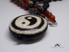 Ancient natural Yin-yang pendant necklace. With dZi beads mixed black agate and rare Carnelian. The ancient Tibetan Dzi beads have only a few million worldwide are rare. Natural amulet and the natural gemstone for good luck and Tibetan stone beads. Agate dZi creates a very strong magnetic field. Bring in the beauty and order and quiet of these powerful beads in your life. Each bead is unique and has a unique magnetic field. As an original gift for a man or woman a boy or girl. It comes in a gift Black Pearl Ring, Energy Jewelry, Evening Accessories, Moldavite Jewelry, Bead Pendant, Agate Jewelry, Beads Handmade, Black Agate, Gems Jewelry