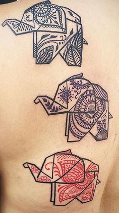 three different tattoos on the back of a man's chest, one with an origami design