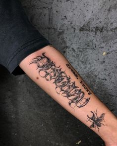 a person with a tattoo on their arm