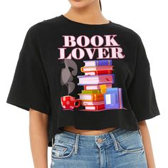 Book Lover Women's Crop Tee Shirt If you're looking for a must-have item to add to your wardrobe, Best Design Cropped T-Shirt is a perfect choice! This comfy cropped t-shirt offers all-day comfort with its side seam and mid-length design. Plus, the retail fit provides an aesthetically pleasing appearance while still providing versatility. Whether you're running errands or out on the town, you'll look and feel fabulous in Cute Design Crop Top. Best Design Cropped T-Shirt Book Lover Women's Crop T Black Bookish Tops With Text Print, Black Bookish Top With Text Print, Black Bookish Top With Letter Print, Black Letter Print Top For Bookish Style, Crop Tee Shirt, Design Crop Top, Varsity Hoodie, Cropped Tee Shirt, Vintage Crop Tops