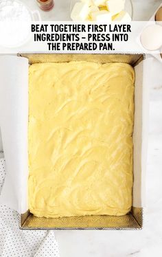 an uncooked cake in a pan with the words be at together first layer ingredients - press into the prepared pan