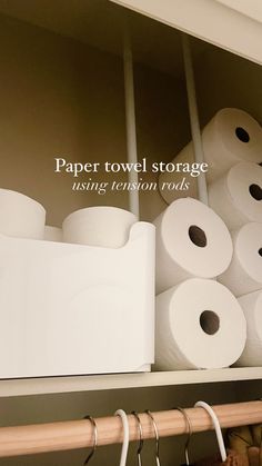 several rolls of toilet paper are stacked on top of each other in a closet with the words paper towel storage using tension rods