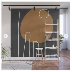 an abstract painting on the wall next to a chair and shelf in a living room