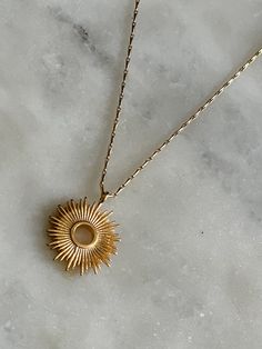 This dainty necklace is a lovely nod to a Monstrance. The radiant sunburst reminds us of the glorious transfiguration of our Lord and that we are each called to be examples of His radiance here on earth. This necklace would also make a lovely gift for First Communion when they are first taking The Eucharist and understanding of His Real Presence, or a great reminder of His Presence as a gift for Confirmation. Also available, are our Adoremus Stud Earrings. The .5" pendant is strung on a 16" barl Celestial Pendant Necklaces For Everyday, Sun And Moon Design Sunburst Jewelry Gift, Adjustable Spiritual Necklace With Sun Design, Adjustable Spiritual Sun Design Necklace, Spiritual Adjustable Sun Design Necklace, Celestial Style Necklaces With Sun Design For Gifts, Celestial Sun Design Necklaces As A Gift, Celestial Sun Design Necklaces For Gifts, Celestial Sun Design Necklaces As Gifts