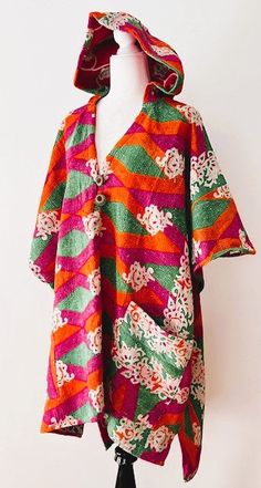 This Kantha Coats is a gorgeous poncho design featuring 3 layers of fine Kantha embroidered saree. Fully reversible, in a patchwork multi color print , BUT remember to remove the brand tag sewn in the neckline.Style is casual, worn for outdoor events, flexible for multi purpose use. Suitable for the office, lunches, beach, sailing, etc. Worn as a duster, no closures, designed to be worn loose. May add belt if prefered. Designed to be loose and flowing. Generous cut. One-of-a-kind, unisex, one si Traditional Festive Kaftan With Vibrant Print, Festive Traditional Kaftan With Vibrant Print, Festive Bohemian Kurta With Vibrant Print, Green Bohemian Tunic For Festive Occasions, Pink Bohemian Kimono For Festive Occasions, Bohemian Green Festive Tunic, Festive Bohemian Multicolor Tunic, Festive Multicolor Bohemian Tunic, Long Sleeve Multicolor Tunic For Festive Occasions