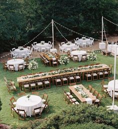 an outdoor wedding reception setup with tables and chairs