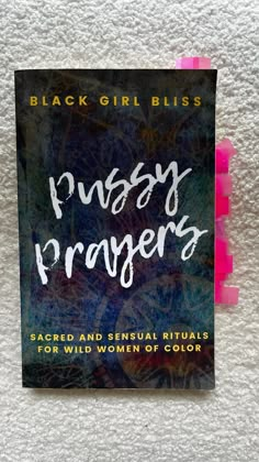 a book with the title pussyy prayer written in white and pink ink on it