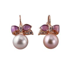 Pair of Mimi Milano Ribbon earrings in 18k gold, with white sapphires, amethyst and pearls. Retail $4190. DESIGNER: Mimi Milano MATERIAL: 18k Gold GEMSTONES: Sapphire, Amethyst, Pearl DIMENSIONS: Earrings are 25mm x 16mm. MARKED/TESTED: Mimi mark, 750, Italian mark. WEIGHT: 10 grams CONDITION: New/Store Sample Elegant Purple Gemstone Pearl Earrings, Elegant Purple Pearl Earrings For Formal Occasions, Elegant Pink Amethyst Earrings, Elegant Purple Pearl Earrings, Elegant Amethyst Earrings As A Gift, Formal Purple Pearl Drop Earrings, Elegant Amethyst Pearl Drop Earrings, Elegant Amethyst Earrings With Pearl Drop, Ribbon Earrings