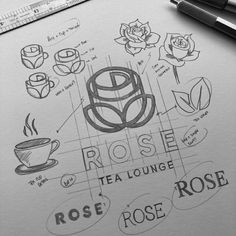 the rose tea lounge logo is drawn on top of a piece of paper next to a pen