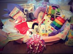 a pink basket filled with lots of different items