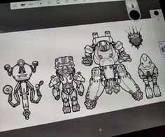 three robots drawn in black and white on a piece of paper